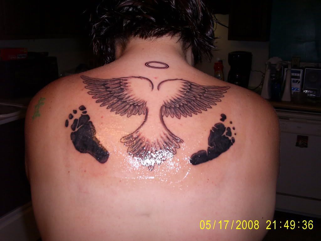 Back Tattoo With Angel,Foot And Tribal Tattoo Designs,Angel Tattoos,Foot tattoos,Lower Back Tattoo,Tribal Tattto,Man Tattoos,religious tattoos,Ink Tattoo,Permanent tattoo
