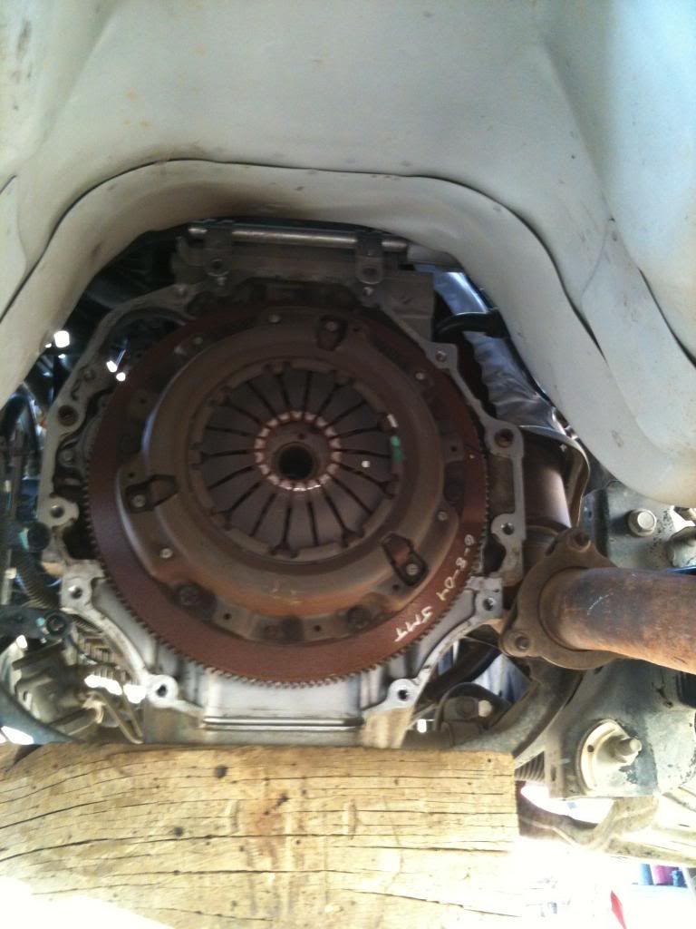 Step 12: Remove the 6 pressure plate bolts, and remove the pressure plate and clutch disc. Throw away the pressure plate bolts, they are not supposed to be ...